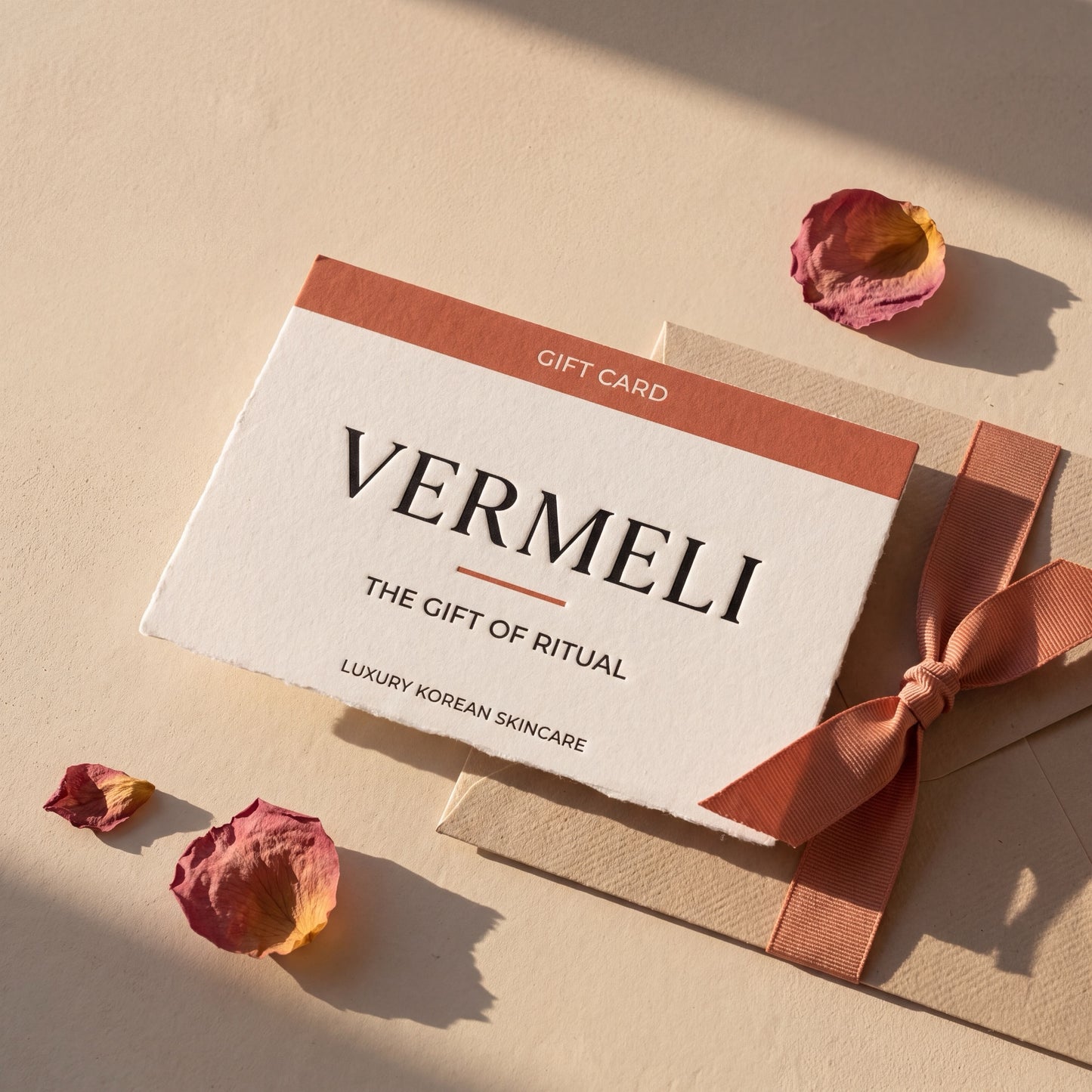 VERMELI gift card, letterpressed on cotton card stock with a sand envelope and terracotta ribbon
